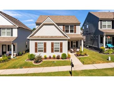Charming two-story home featuring manicured lawn and lovely front porch at 637 Sunflower Dr, Canton, GA 30114