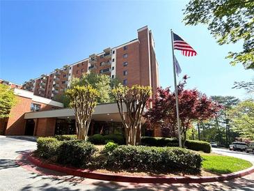 Beautiful exterior view of building with an American flag waving in the wind at 300 Johnson Ferry Rd # B105, Atlanta, GA 30328