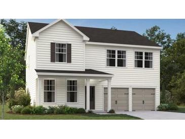 Charming two-story home with white siding, black roof, and a two-car garage at 2109 Boxwood Se Cir, Conyers, GA 30094
