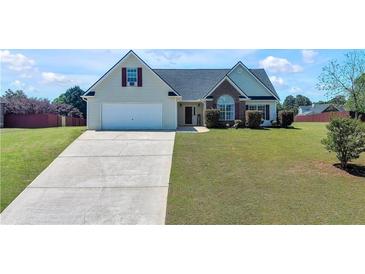 Charming single-Gathering home with a well-manicured lawn and a two-car garage at 502 Owens Springs Ln, Mcdonough, GA 30252