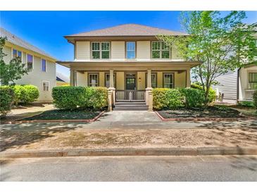 Charming two-story home with a inviting front porch and well-maintained landscaping at 3278 Shakerley Park, Douglasville, GA 30135