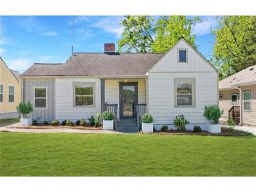 Charming single-story home with well-maintained lawn, classic architecture, and inviting curb appeal at 1560 Temple Ave, College Park, GA 30337