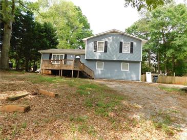 Charming home featuring a welcoming front porch and a traditional two-story design at 464 Mephisto Cir, Lawrenceville, GA 30046