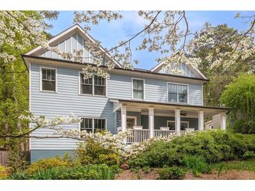 Charming two-story home with light blue siding and covered front porch at 2634 Charlesgate Ave, Decatur, GA 30030