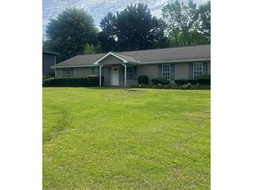 Charming single-story home with well-maintained lawn and inviting curb appeal at 4184 Red Laurel Way, Snellville, GA 30039
