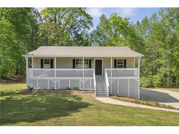 Charming home with a welcoming front porch and well-maintained lawn at 201 Rustin Dr, Dallas, GA 30157