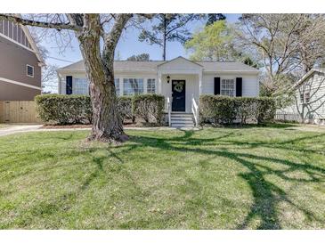 Charming single-story home with white siding and well-manicured landscaping at 2982 Ringle Rd, Brookhaven, GA 30341