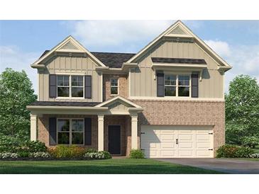 Charming two-story home featuring a brick and siding exterior, complemented by dark shutters and a well-manicured lawn at 1129 Georgian Point Dr, Lawrenceville, GA 30045