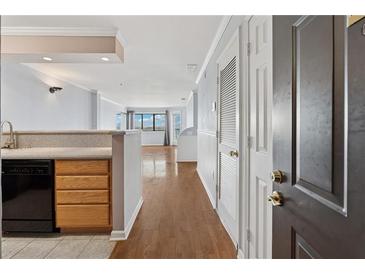 Open-concept living area featuring hardwood floors and abundant natural light at 795 Hammond Dr # 2101, Atlanta, GA 30328