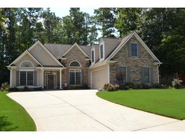 Charming single Gathering home with stone accents and a well manicured lawn in a lovely residential neighborhood at 40 Templeton Ln, Villa Rica, GA 30180