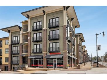 Contemporary four-story apartment building boasting private balconies and street-level commercial spaces at 5300 Peachtree Rd # 3601, Atlanta, GA 30341