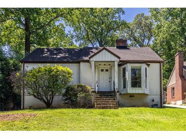 Charming single-story home with a welcoming front entrance and well-maintained landscaping at 536 Trabert Nw Ave, Atlanta, GA 30309