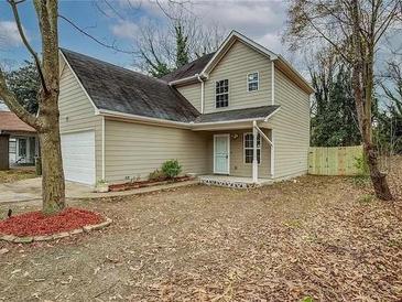 Charming two-story home with neutral siding and well-maintained landscaping at 1526 Venetian Sw Dr, Atlanta, GA 30311