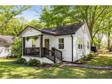 Charming bungalow with a cozy front porch and well-maintained landscaping creates curb appeal at 324 Pine Ne St, Marietta, GA 30060