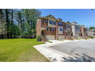Beautiful brick townhomes with private garages and manicured front yards, perfect for comfortable living at 3155 Boldmere Se Trl # 3, Smyrna, GA 30080