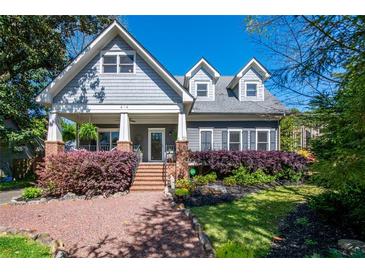Charming home with inviting front porch and beautiful landscaping at 414 Pensdale Rd, Decatur, GA 30030