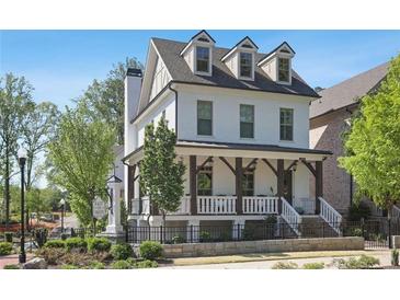 Charming two-story home with a welcoming front porch and dormer windows, set in a well-manicured community at 123 Cricket Ln, Alpharetta, GA 30009