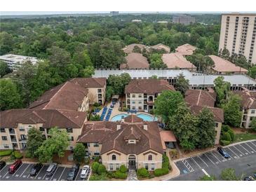 Stunning aerial view of community, showcasing the pool, landscaping, and architecture at 3777 Peachtree Ne Rd # 1536, Atlanta, GA 30319