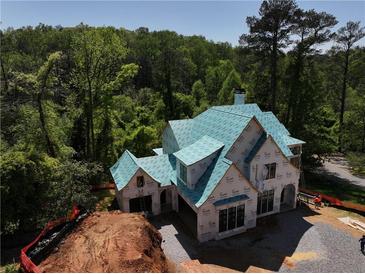 New construction home featuring Tyvek house wrap and beautiful wooded surroundings at 469 Emily Reed Ln, Atlanta, GA 30342