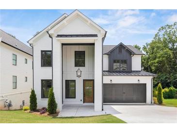 New construction home with painted brick, modern design, and professional landscaping at 267 Green Hill Rd, Sandy Springs, GA 30042