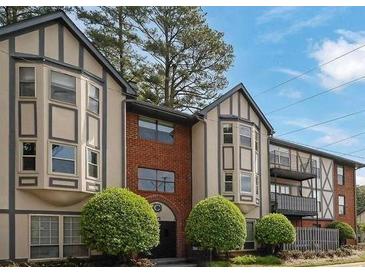 Lovely multi-Gathering residential exterior displaying a two-story facade with a charming brick accent and manicured greenery at 6851 Roswell Rd # C7, Atlanta, GA 30328