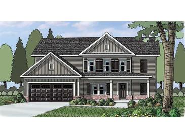 Charming two-story home features a dark gray exterior, a two-car garage, and a well-manicured front yard at 1238 Cherry Bark Ct, Loganville, GA 30052