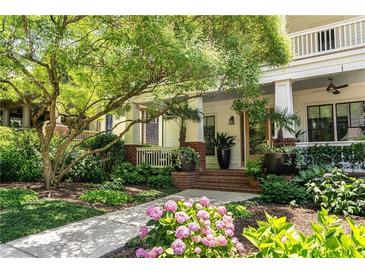 Charming home entrance featuring a covered porch, meticulous landscaping, and a welcoming walkway at 1601 Marlbrook Ne Dr, Atlanta, GA 30307