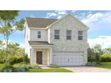 Charming two-story home featuring a light brick facade and attached two-car garage at 4191 Brindle Pl, Loganville, GA 30052