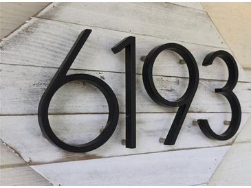 Close-up of the house number '6193' mounted on a decorative white-washed wooden plaque at 6193 Charring Cross Ct, Lithonia, GA 30058