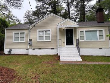 Charming single-Gathering home with neutral siding, black front door, and white trim on a well-maintained lawn at 1297 Cahaba Dr, Atlanta, GA 30311