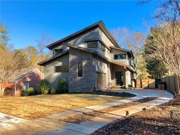 Beautiful contemporary two-story home with manicured lawn and a long private driveway at 246 Garland Ave, Decatur, GA 30030