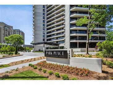Luxury condo building, Park Place on Peachtree, with manicured lawn and colorful flowers at 2660 Peachtree Nw Rd # 4G, Atlanta, GA 30305