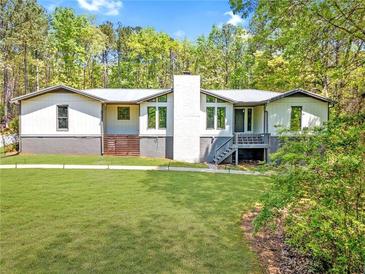 Charming single-Gathering home with a well-manicured lawn and beautiful natural surroundings at 2784 Sixes Rd, Canton, GA 30114