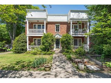Charming brick townhouse featuring double balconies and lush landscaping at 974 Greenwood Ne Ave # 6, Atlanta, GA 30306