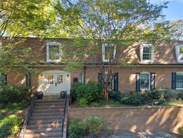 Charming two-story brick home with a welcoming entrance and lush landscaping at 1261 Lavista Rd # C3, Atlanta, GA 30324