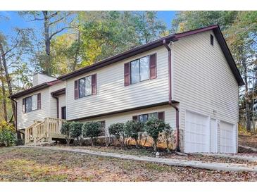 Charming two-story home with a two-car garage, nice landscaping, and a cozy front porch at 4391 Sandy Plains Rd, Marietta, GA 30066