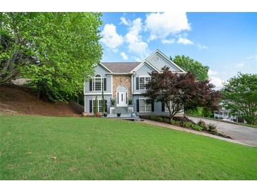 Charming home with a well-manicured lawn, beautiful landscaping and traditional architectural details at 31 Clearview Dr, Cartersville, GA 30121
