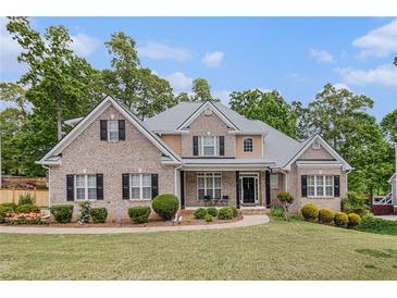 Charming brick home with manicured lawn and mature trees in a desirable neighborhood at 2920 Stanway Ave, Douglasville, GA 30135