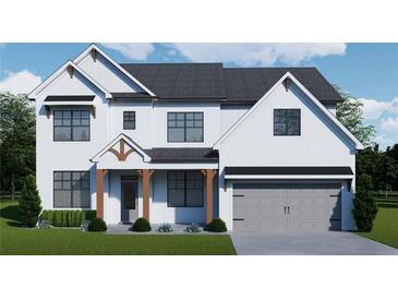 Charming two-story home with a white brick facade, gray roof, and attached two-car garage at 3900 Ivy Cottage Dr, Snellville, GA 30039