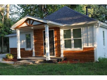 Charming renovated home featuring a welcoming front porch and wood-accented siding at 2040 Penelope Nw St, Atlanta, GA 30314