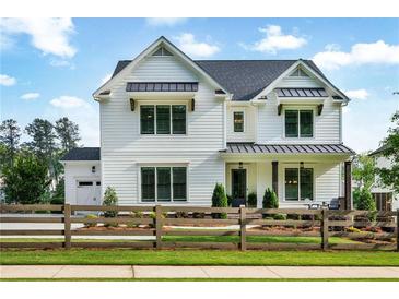 Charming two-story home with a landscaped yard and inviting curb appeal at 2201 Old Dallas Sw Rd, Marietta, GA 30064