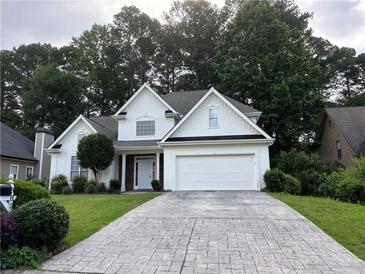 Charming one-story home with a beautiful driveway and a well maintained landscaped yard at 3850 Laurel Nw Dr, Acworth, GA 30101
