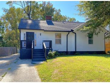 Charming home featuring a well-maintained lawn, classic curb appeal, and inviting front entry at 1384 Allegheny Sw St, Atlanta, GA 30310