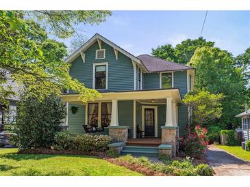 Charming two-story home with a welcoming front porch, stone accents and landscaped yard at 167 E Lake Se Ter, Atlanta, GA 30317