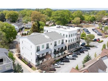 Modern three-story building with balconies, parking, and close proximity to the town square at 160 Fowler St # 100, Woodstock, GA 30188
