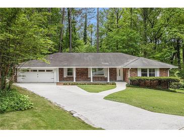 Charming brick home with a well-manicured lawn and inviting driveway at 2429 Sherbrooke Ne Ct, Atlanta, GA 30345