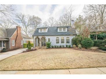Charming two-story home with stone archway and dormer windows at 1195 Cameron Ne Ct, Atlanta, GA 30306