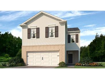 Charming two-story home with white siding, brick accents and an attached two-car garage at 8234 Coldstream Dr, Fairburn, GA 30213