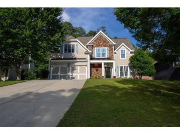 Charming two-story home with stone accents, inviting entrance, and well-manicured lawn at 36 Evergreen Way, Dallas, GA 30157