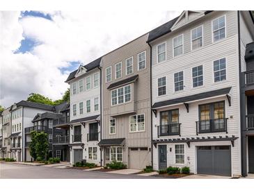 Modern townhome exteriors showcasing neutral color palettes and private garages at 24 Becker Nw Pl, Atlanta, GA 30307